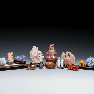 A group of Chinese carvings of lapis lazuli, pink quartz and other precious stones, with several stands, 19/20th C.