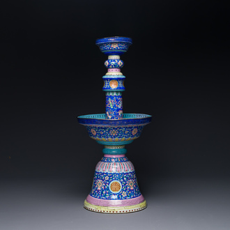 A large Chinese Canton enamel blue-ground 'shou' candlestick, Qianlong/Jiaqing