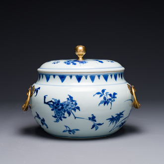 A Chinese blue and white covered bowl with floral design and gilt bronze mounts, Transitional period