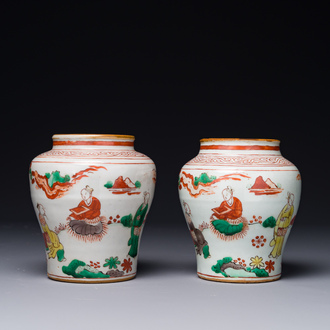 A pair of small Chinese wucai jars with figures in a landscape, Transitional period