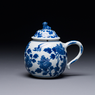 A Chinese blue and white mustard jar and cover with floral design, Kangxi