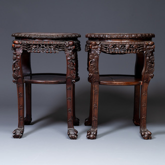 A pair of large Chinese carved wooden stands with marble tops, 19th C.