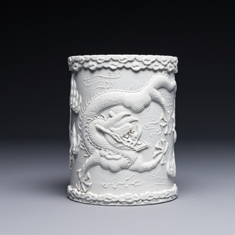 A Chinese monochrome white-glazed biscuit brush pot, signed Wang Bingrong 王炳榮, 19/20th C.