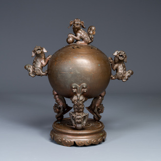 A large Chinese bronze censer and cover on stand decorated with six lions, 19th C.