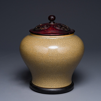 A Chinese ge-type jar with wooden cover and stand, 19th C.