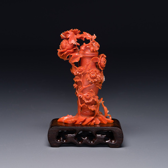 A Chinese red coral sculpture of a vase and cover with peonies, 19/20th C.