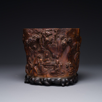 A large Chinese carved huanghuali wooden brush pot with Taoist design, 17/18th C.