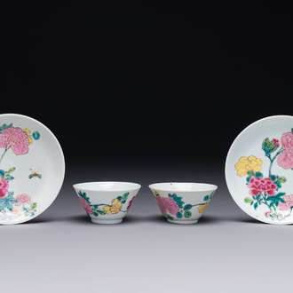 A pair of Chinese famille rose 'peony' cups and saucers, Yongzheng