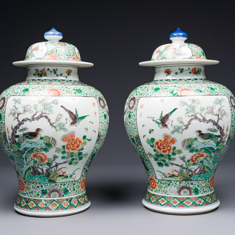 A pair of Chinese famille verte 'bird and flower' vases and covers, Kangxi mark, 19th C.