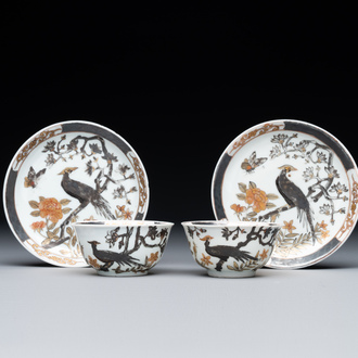 A pair of Chinese grisaille and gilt 'pheasant' cups and saucers, Yongzheng