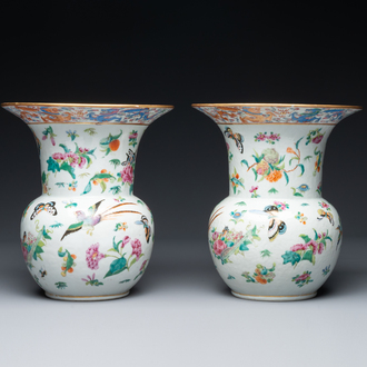 A pair of Chinese Canton famille rose spittoons with dragons, birds, butterflies and flowers, 19th C.