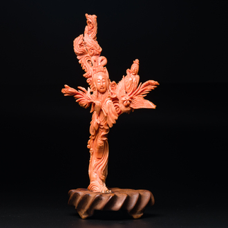 A Chinese red coral figure of Xiwangmu on wooden stand, 19/20th C.