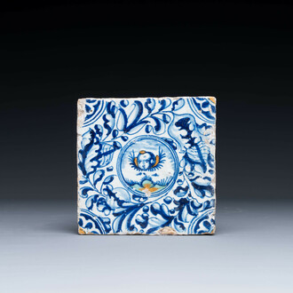 A fine Dutch Delft polychrome maiolica tile with a cherub, ca. 1600