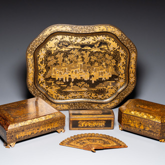 A large Chinese Canton gilt black lacquer tray, thee boxes and a fan, 19th C.