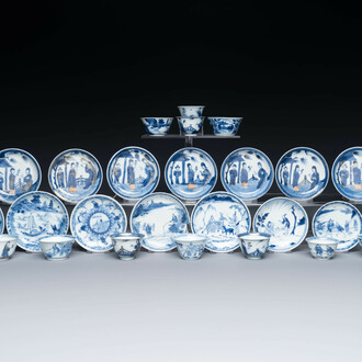 Thirteen Chinese blue and white saucers and twelve cups with figural design, Kangxi/Yongzheng