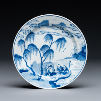 A Chinese blue and white plate with a breastfeeding woman and fishermen on boats, Chenghua mark, Kangxi