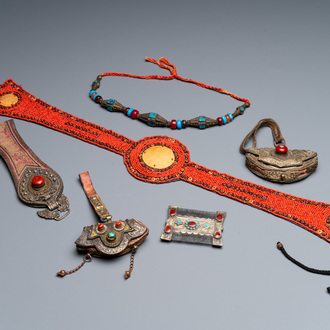 A group of six Tibetan objects of metals and textiles with gem stones, 19th C.