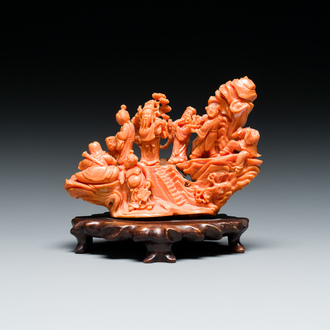 A Chinese red coral 'Eight Immortals' group on wooden stand, 19/20th C.