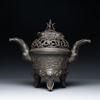 A Chinese bronze 'elephant' tripod censer and cover, Ming