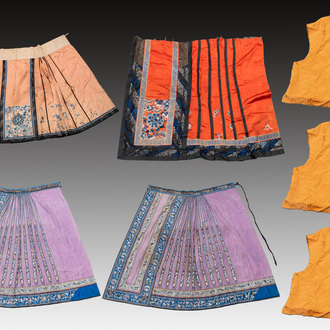 Four Chinese embroidered silk skirts and three yellow 'magua' jackets, 19/20th C.