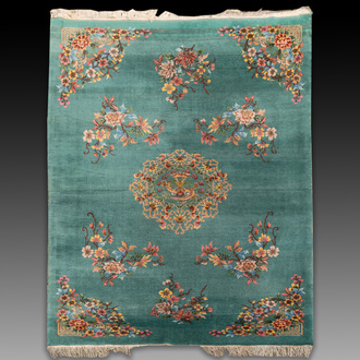 A large Chinese emerald-green-ground carpet with floral design, Republic