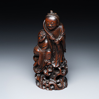 A large Chinese carved bamboo group of 'Hehe Erxian', 17th C.