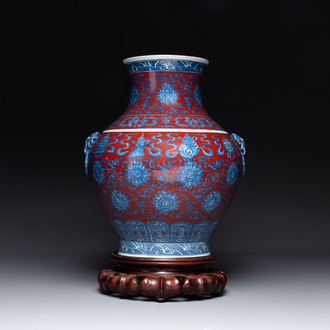 A Chinese blue and white, and iron-red 'bajixiang' 'hu' vase on wooden stand, Qianlong mark, 19th C.