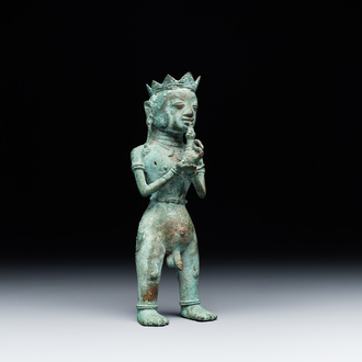 An fine Indonesian bronze sculpture of a naked man offering a sacrificial vase, Majapahit, East Java, 13/14th C.