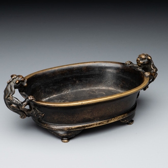 A rare Chinese bronze narcissus basin-shaped censer with dragon handles, Xuande mark, 17th C.