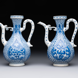 A pair of Chinese blue and white ewers with floral design, Kangxi