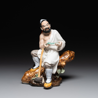 A Chinese polychrome sculpture of a lumberjack, Jingdezheng mark, 20th C.