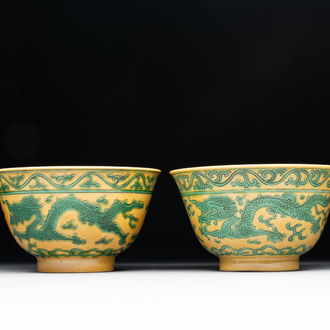 A pair of Chinese yellow-ground 'dragon' and 'shou' bowls, Guangxu mark and of the period