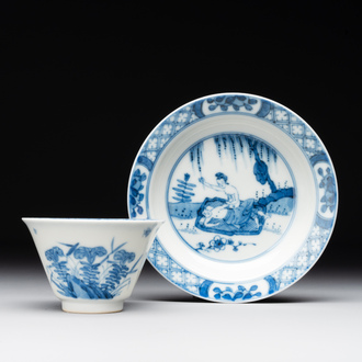 A Chinese blue and white 'erotic' cup and saucer, Kangxi