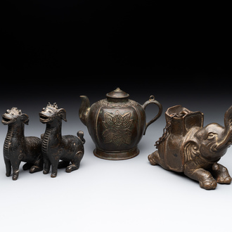 A pair of Chinese bronze mythical creatures and two ewers, Ming