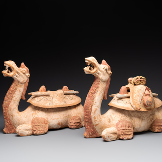 A pair of Chinese polychrome-painted terracotta camels with saddles, Tang