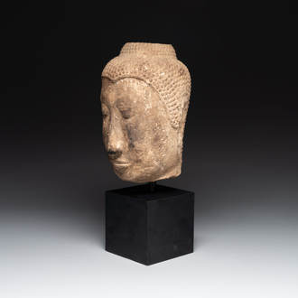 A Thai sandstone head of Buddha, possibly Ayutthaya period, 14/15th C.