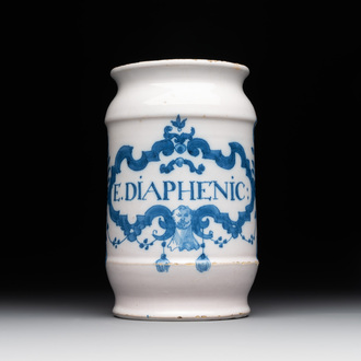 A blue and white Brussels faience albarello with a satyr head, inscribed 'E. DIAPHENIC:', 18th C.
