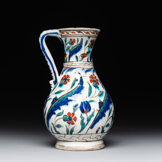 A polychrome and gilt Iznik ewer with tulips, carnation flowers and saz leaves, Turkey, ca. 1600