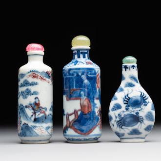 Two Chinese blue, white and copper-red snuff bottles and a blue and white 'crab' snuff bottle, Chenghua and Qianlong mark, 19th C.