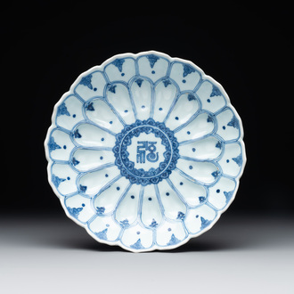 A rare Chinese lotus-shaped blue and white 'fu' dish, Kangxi mark and of the period