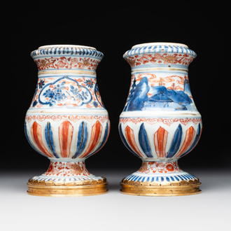 A pair of Chinese Imari-style casters or vases with gilt bronze mounts, Kangxi