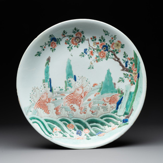 A Chinese famille verte 'leaping carps' dish, artemisia leaf mark, Kangxi