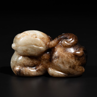 A Chinese celadon and russet jade mythical beast carving, Ming