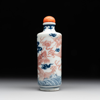 A Chinese blue, white and copper-red 'dragon' snuff bottle, 19th C.