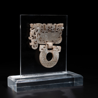 A Chinese nephrite jade 'bi' disc representing a Taotie mask, Han