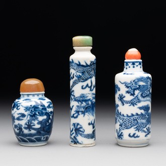 Three Chinese blue and white 'dragon' snuff bottles, 19th C.