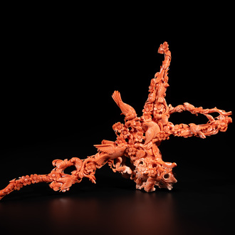 A Chinese red coral group of birds among flowering branches, 19/20th C.