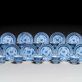 Eleven Chinese blue and white 'crab and fish' cups and saucers, Kangxi mark, Guangxu