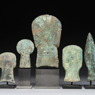 Four Chinese and Vietnamese bronze axes and an arrowhead, Western Zhou/Dong Son