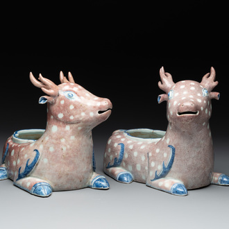 A pair of Chinese blue, white and copper-red stag-shaped jardinières, 19th C.